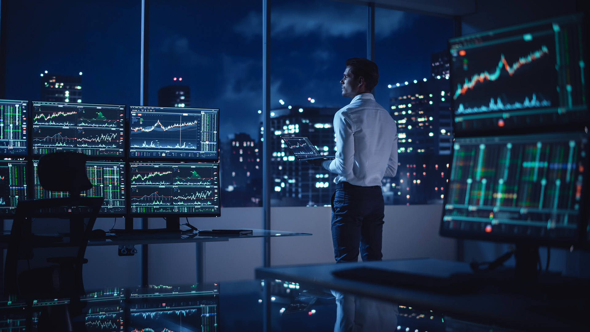 An investor watching his trades on multiple monitors amid Markets Are Waiting for the Jobs Data Tomorrow